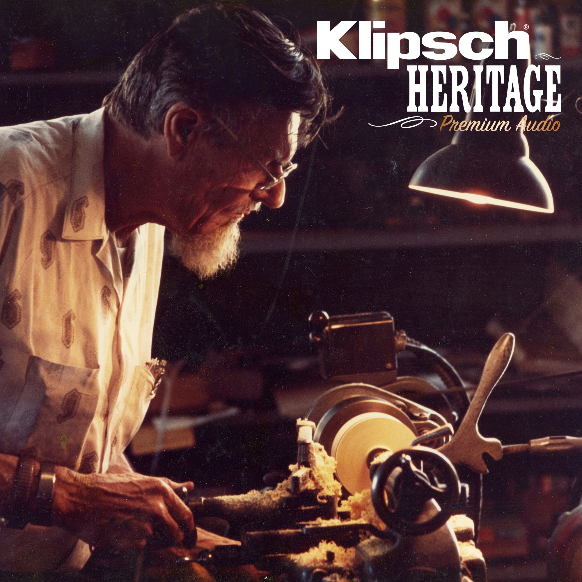 Paul W Klipsch working in the shop with a Klipsch Heritage Premium Audio logo overlaid on the image